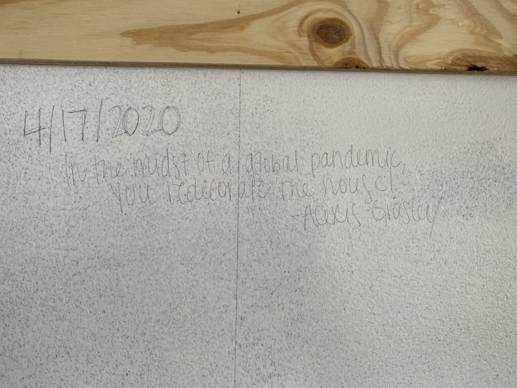 plywood shiplap write on wall behind it