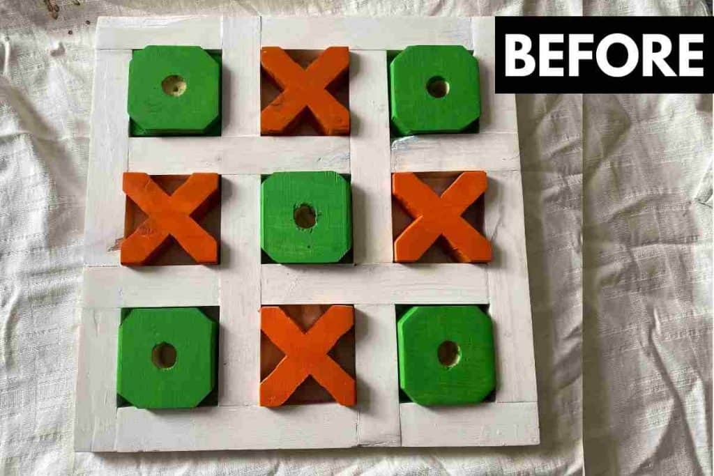 tic tac toe board made from wood with green o's and orange x's