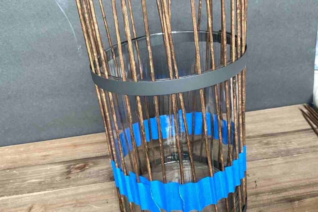 Wood Skewers attached to vase with blue painters tape and duct clamp
