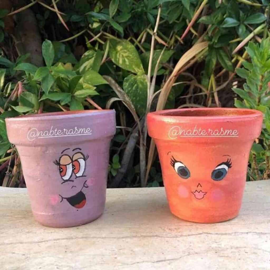 hand painted flower pots with fun faces on them