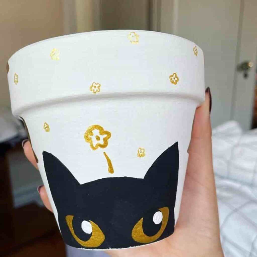 black cat pot painting
