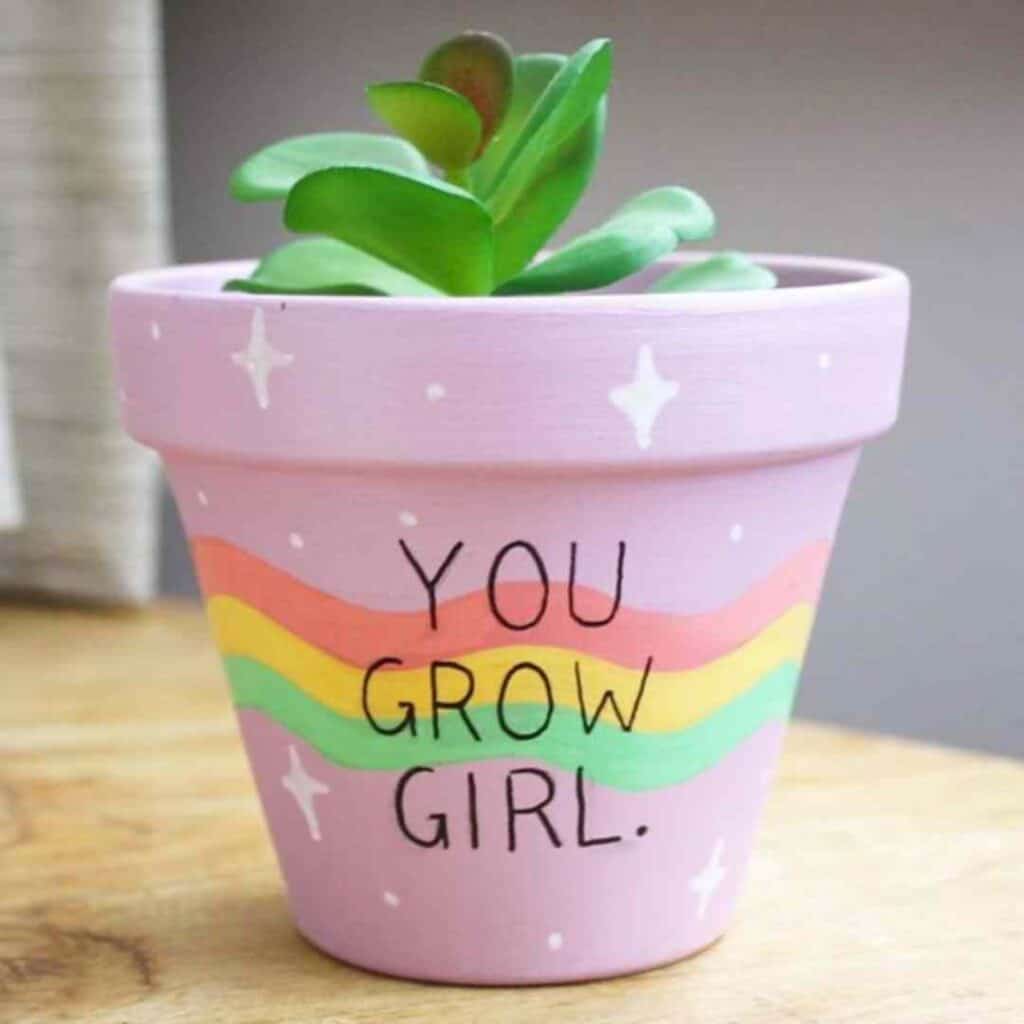 hand painted pot pink green yellow and orange rainbow with the you grow girl saying