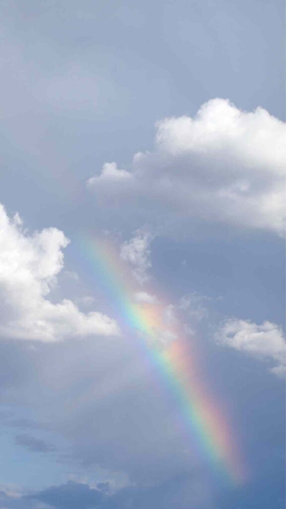 aesthetic cloud wallpaper with rainbow in sky