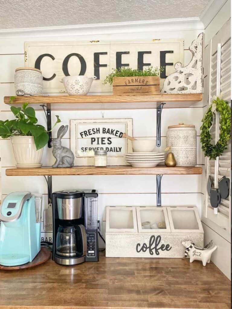 coffee bar corner nook on counter with two shelves and large coffee sign