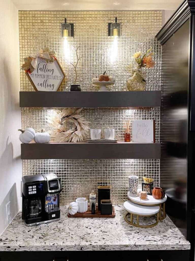 coffee bar nook with metallic tile backsplash and thick wood shelves