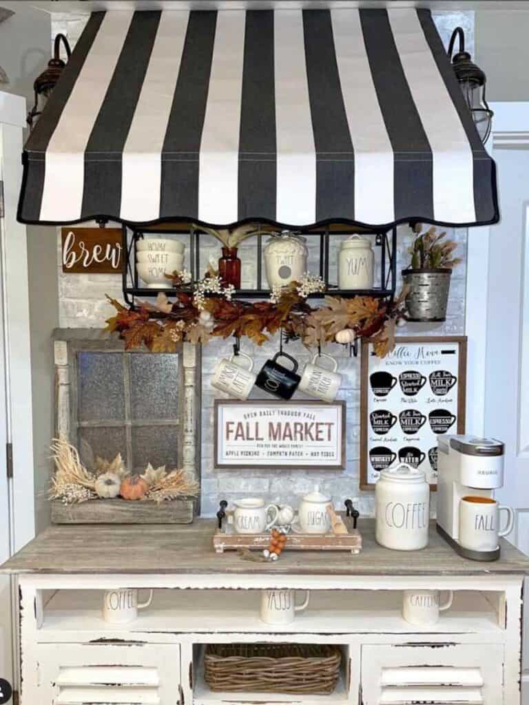 fall coffee bar with black and white awning over it