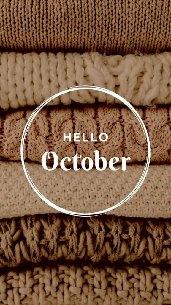 Hello October wallpaper with pile of neutral sweaters