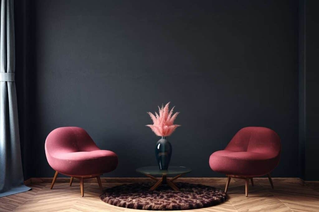 charcoal gray wall with fuchsia chairs