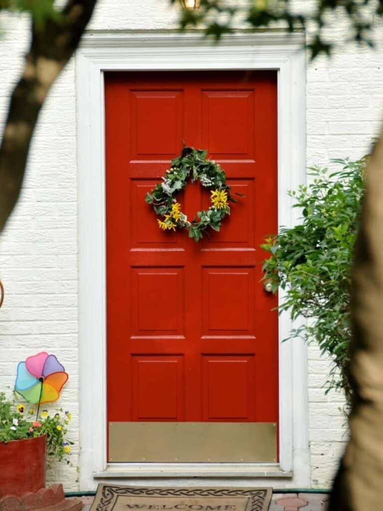 white brick house red door