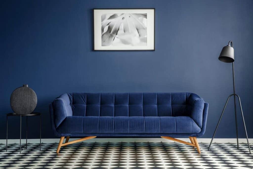 navy blue walls and couch with black accents