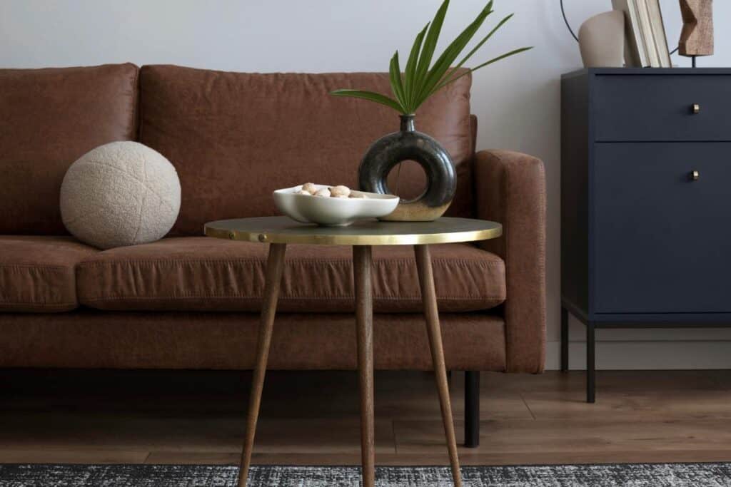 brown sofa with navy blue table