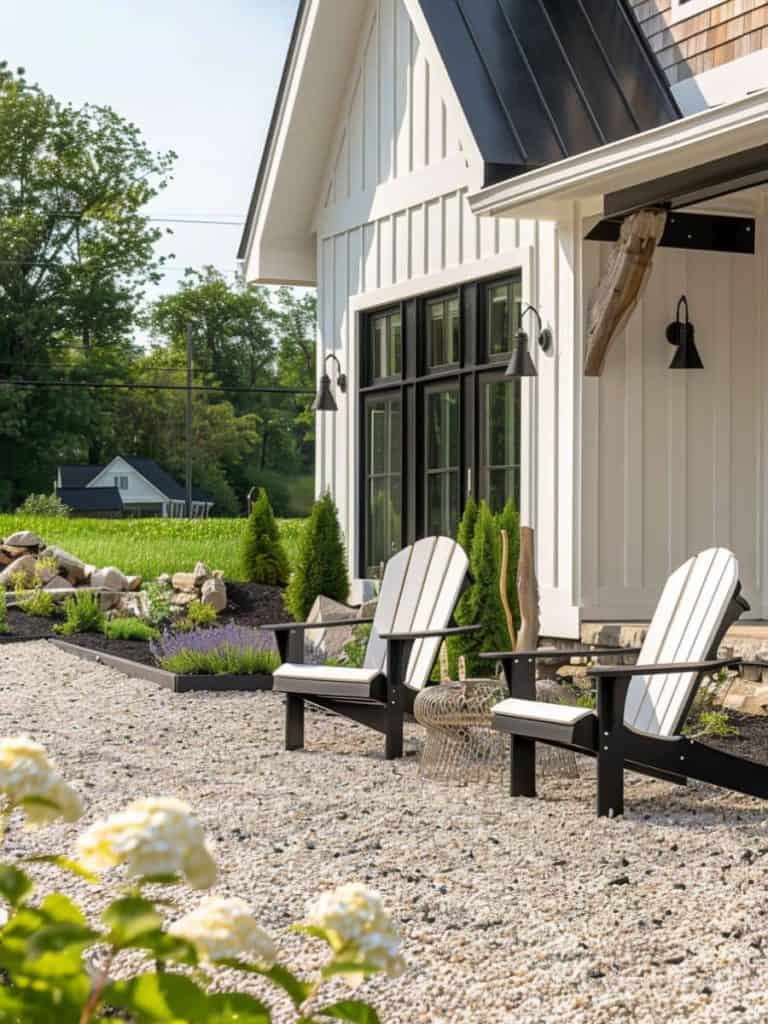 Traditional black Adirondack chairs on a gravel patio overlooking a well-manicured garden, inviting peaceful contemplation
